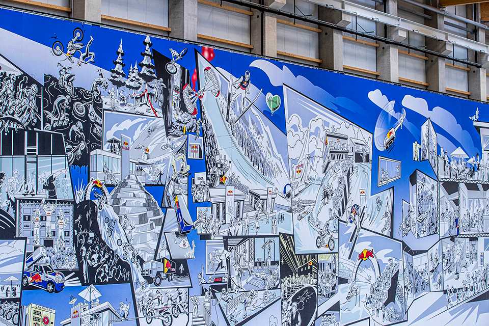 Wandbild der Red Bull Energy Station Oberwang mit Sportmotiven.