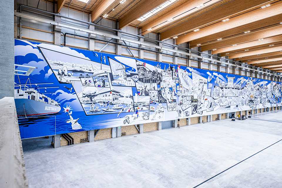 Red Bull Energy Station Department Oberwang: Großes Wandbild mit blauen und weißen Illustrationen.